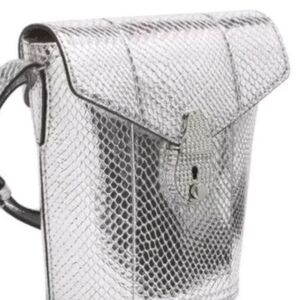 Calvin Klein mini bucket coach bag silver snake series with push button lock.